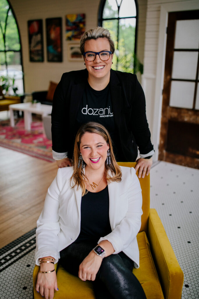 Michelle sitting in a chair with Katherine behind her.